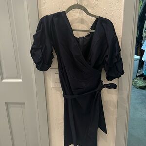 Navy dress, knee length.